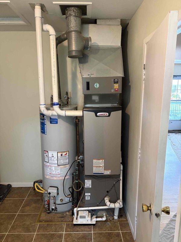 Completed full furnace installation of a 70,000 BTU Lennox unit including all mechanical and electrical connections. Installed new furnace in utility closet adjacent to existing water heater, ran and terminated PVC venting through roof alongside existing chimney, connected galvanized supply ductwork, and installed condensate drainage system with pump. Energized unit, verified proper operation of all controls and safety devices, and confirmed adequate airflow throughout system.