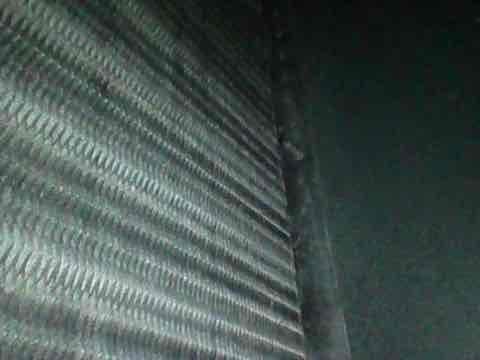 Completed scheduled HVAC heating system maintenance as part of membership club visit with no reported issues or symptoms. Performed comprehensive tune-up inspection of air handler and heat exchanger assembly, noting dust accumulation on evaporator coil fins and exterior unit housing. All components found operational during routine preventive maintenance service.