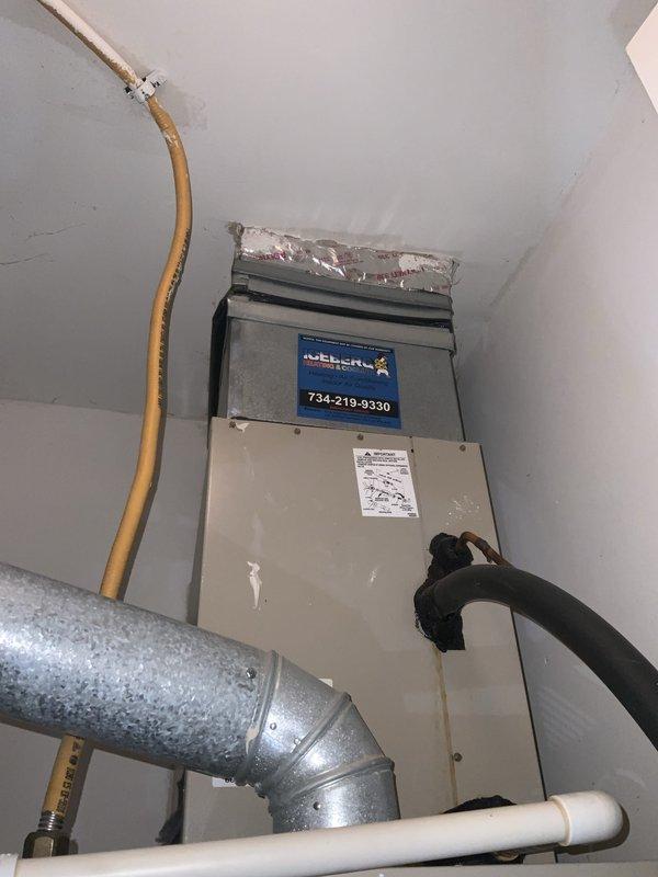 Completed scheduled HVAC maintenance tune-up on residential air handler system as part of club membership agreement. Performed comprehensive inspection of vertical air handler unit, checked all electrical connections at junction box, verified proper refrigerant line connections, and inspected ductwork and condensate drainage system. All components found operating within normal parameters with no issues identified; system ready for continued service.