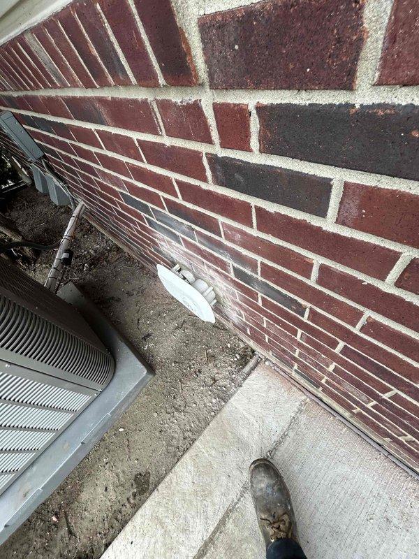 Responded to callback for venting termination issue on exterior wall. Corrected the outside termination point where exhaust venting exits through brick foundation, ensuring proper mounting and seal of the termination plate against the wall surface. Verified venting system integrity and confirmed proper installation per manufacturer specifications.