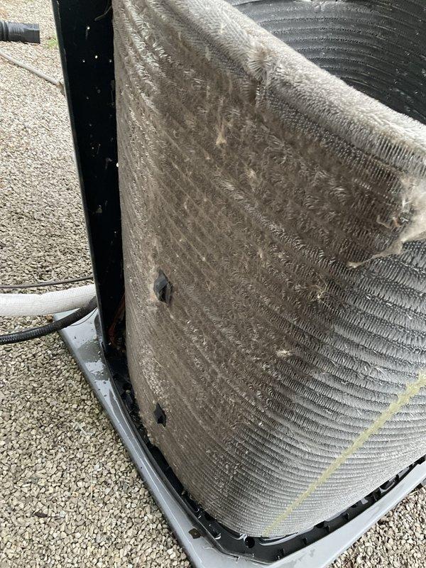 Completed scheduled HVAC maintenance agreement visit for tune-up service on residential air conditioning system with no reported issues. Upon arrival, found outdoor condensing unit with heavily soiled condenser coil fins showing significant accumulation of dust, dirt, and environmental debris blocking airflow passages throughout the coil surface. Performed comprehensive system inspection and cleaning, including thorough condenser coil cleaning to remove buildup and restore proper airflow through fins. Verified unit operation and system performance following maintenance procedures. System restored to optimal operating condition with improved heat transfer efficiency.