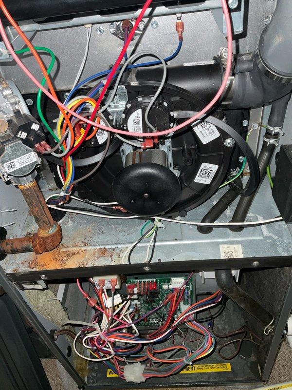 Completed preventive maintenance tune-up on residential AC and furnace system. Inspected internal components including compressor, electrical controls, and circuit board; noted copper piping showing oxidation at connection points and debris accumulation in drain pan requiring cleaning. All electrical connections, wiring, and control systems verified operational, with system returned to normal service parameters.