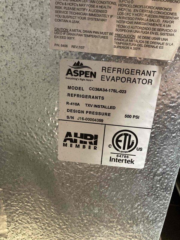 Completed scheduled maintenance tune-up on Aspen refrigerant evaporator unit (Model CC36A34-175L-023) utilizing R-410A refrigerant with TXV installed. Verified system specifications, performed diagnostic temperature readings measuring 59.2°F, and documented equipment nameplate data including 500 PSI design pressure rating and serial number for maintenance records.