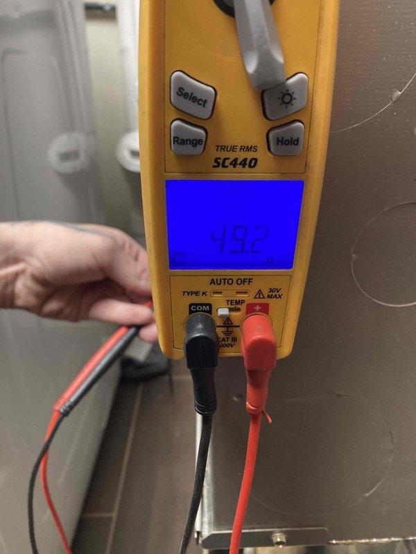 Completed scheduled maintenance tune-up on Aspen refrigerant evaporator unit (Model CC36A34-175L-023) utilizing R-410A refrigerant with TXV installed. Verified system specifications, performed diagnostic temperature readings measuring 59.2°F, and documented equipment nameplate data including 500 PSI design pressure rating and serial number for maintenance records.
