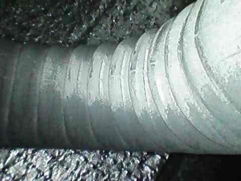 Completed preventive maintenance inspection on club AC8-12 system. Discovered significant frost and ice buildup on supply ductwork and flexible ducting in attic space, indicating restricted airflow or refrigerant issues. Documented conditions with photos showing extensive crystalline frost accumulation on rigid and flexible duct sections, suggesting potential low airflow, dirty evaporator coil, or refrigerant charge concerns requiring further diagnostic evaluation and correction.