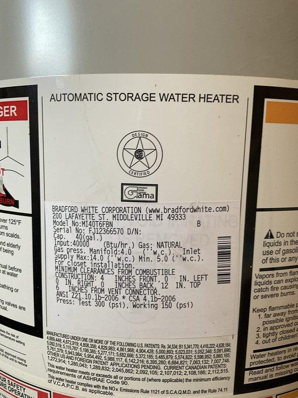 Completed electrical estimate for new whole home generator installation at manufactured home. Assessed existing natural gas meter and supply infrastructure, noting aged piping with corrosion on existing gas lines that will require consideration during installation planning. Documented 40-gallon Bradford White natural gas water heater (Model MI40T6FBN, 40,000 BTU/hr input) to evaluate total gas demand and verify adequate capacity for generator addition to existing natural gas system.