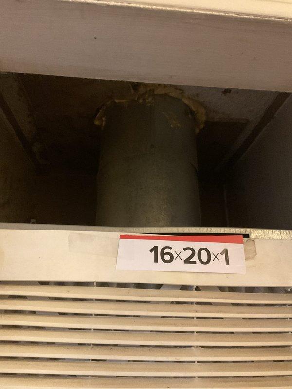 Conducted on-site evaluation of existing HVAC system for equipment replacement estimate. Documented current furnace/air handler unit installed in interior closet space with louvered doors, photographed manufacturer labels and model information for specification purposes. Assessed mechanical space configuration including aged cylindrical expansion tank in ceiling cavity and return air grille with 16x20x1 filter dimension. Gathered necessary equipment data and system specifications to prepare comprehensive replacement proposal.