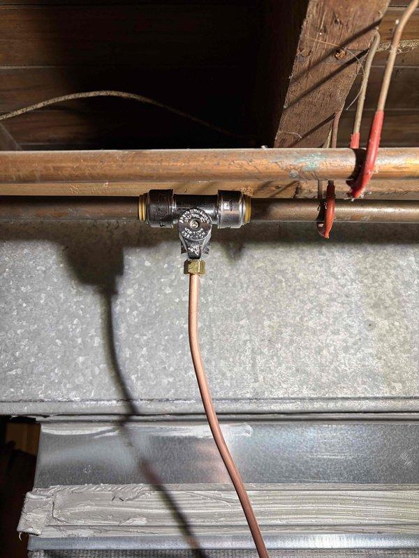 Completed full furnace installation including mechanical and electrical connections in basement mechanical room. Installed new high-efficiency furnace unit with proper PVC venting system routed vertically through structure, connected humidifier to copper supply line with shutoff valve in upper level, and reconnected all ductwork to existing plenum. All components tested and operational upon completion.
