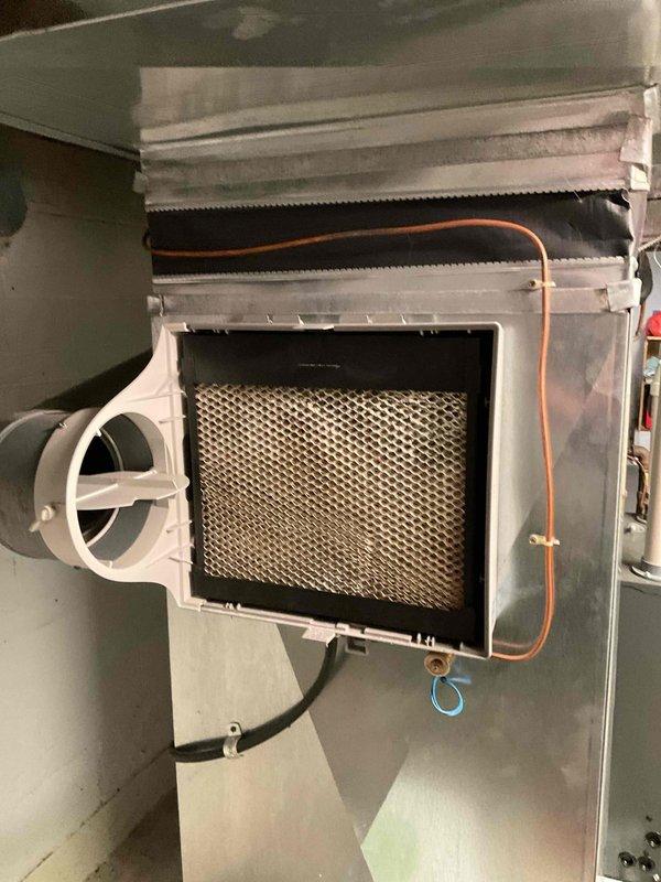 Completed scheduled maintenance agreement visit for air handler and system inspection under Club Heat8-12 program. Performed comprehensive inspection of HVAC air handler components including return air filter housing, ductwork connections, and refrigerant lines. Verified proper installation and condition of white plastic-framed filter housing with mesh metal filter, confirming adequate airflow through return air system. Inspected flexible duct connections, copper refrigerant tubing, and electrical wiring for secure mounting and proper operation. Documented system conditions through photographs showing filter assembly, duct connections, and associated components within mechanical room installation. All components found operating within normal parameters with no immediate service needs identified. System tagged and ready for continued operation.