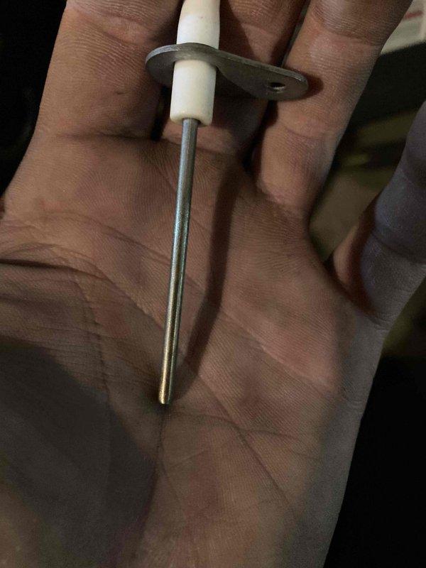 Responded to no-heat call on furnace system. Upon inspection, found faulty gas valve orifices and flame sensor preventing proper ignition sequence. Removed and examined three worn gas valve orifices showing signs of corrosion and buildup around perimeter holes and central openings. Replaced flame sensor rod assembly which had deteriorated metallic probe affecting flame detection capability. Restored proper furnace operation and verified ignition cycle functioning correctly.