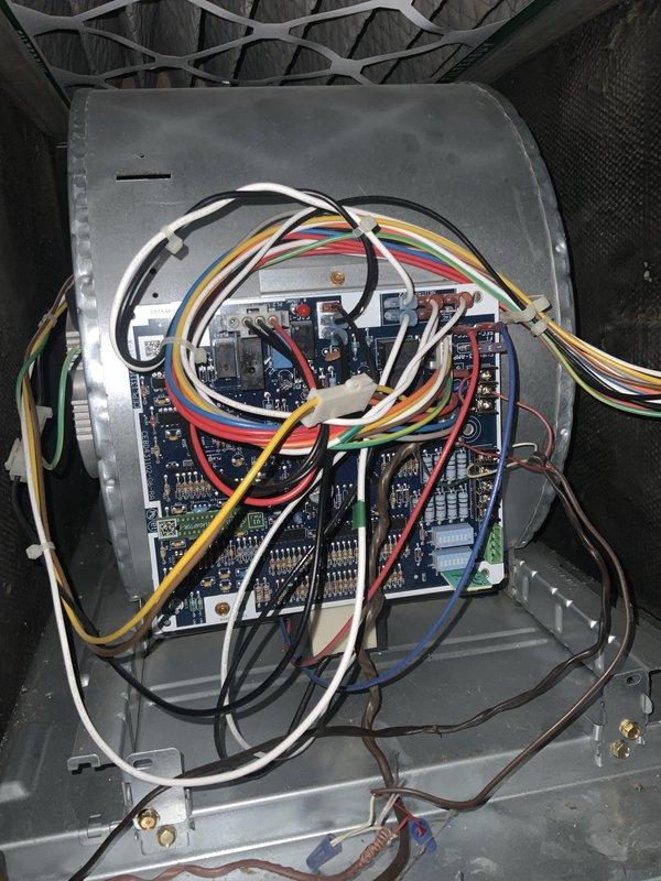 Completed routine HVAC heating maintenance tune-up as requested with no issues reported. Performed comprehensive system inspection including control board examination, electrical connections verification, and assessment of ductwork and piping components. Documented equipment condition with photos showing control panel circuitry and mechanical room components with noted dust accumulation on ductwork requiring future attention.