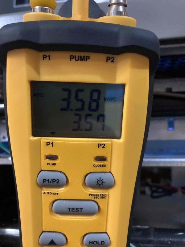 Completed scheduled club maintenance agreement visit on heating system. Performed comprehensive diagnostics using digital clamp meter to verify electrical draw readings at 0.128 AC amps, confirming proper amperage levels within manufacturer specifications. Utilized differential pressure manometer to measure and document static pressures, recording readings of 358 and 359 InWC on P1 and P2 ports to assess system airflow and verify proper operation of heating equipment. All measurements indicated furnace operating within normal parameters with no deficiencies noted during inspection.