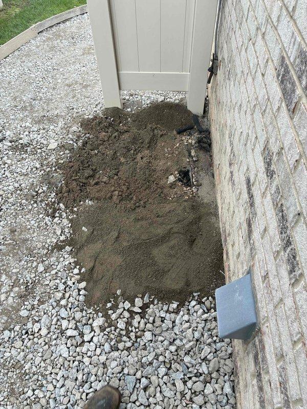 Removed existing outdoor condenser unit in preparation for scheduled equipment installation. Excavated and cleared installation area, exposing soil base and ensuring proper access for new unit placement. Site prepared and ready for upcoming HVAC system installation scheduled for 8-12.