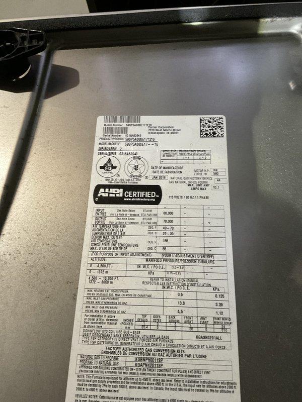 Completed preventative maintenance tune-up on Goodman DGFPA048ST1 gas furnace unit. Performed standard system inspection, verified AHRI certification specifications, checked air flow through supply vents, and documented equipment condition with photos of unit data plate and vent assembly.