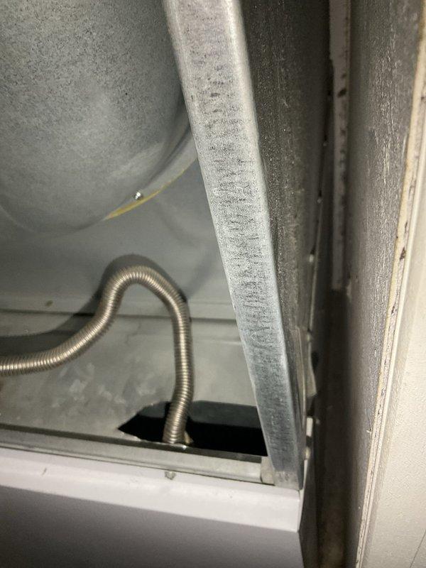 Performed on-site evaluation of 19-year-old furnace system with failed inducer motor. Documented existing equipment condition including thermostat operation and internal cabinet components showing significant frost accumulation indicative of airflow restrictions or refrigerant issues. Provided comprehensive replacement estimate for furnace system due to age of unit and cost-effectiveness of full replacement versus component repair on aging equipment.