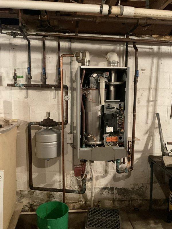 Conducted comprehensive boiler replacement estimate for non-operational heating system in basement mechanical room. Evaluated existing aged boiler unit with associated piping infrastructure, expansion tank, and ventilation components to determine replacement specifications and scope of work required to restore heating functionality.