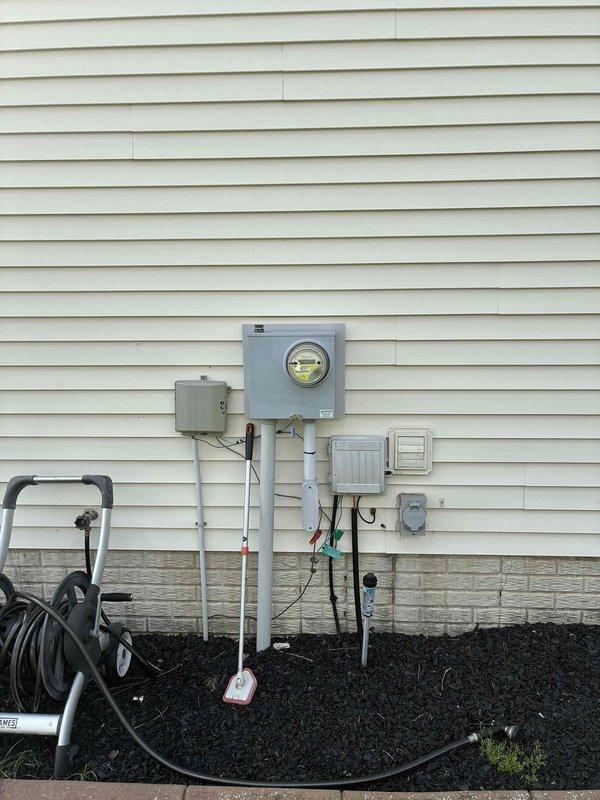 Completed electrical estimate for new whole home generator installation at residential property. Assessed existing electrical service entrance configuration including main meter panel, service disconnect boxes, and available conduit pathways on exterior wall with vinyl siding. Evaluated interior electrical panel system consisting of main distribution panel with digital monitoring display and sub-panel to determine capacity and compatibility for generator integration. Documented current electrical infrastructure including circuit breaker configuration, available breaker spaces, and necessary connection points for automatic transfer switch installation. Provided comprehensive assessment for generator placement, electrical service requirements, and integration with existing residential electrical system.