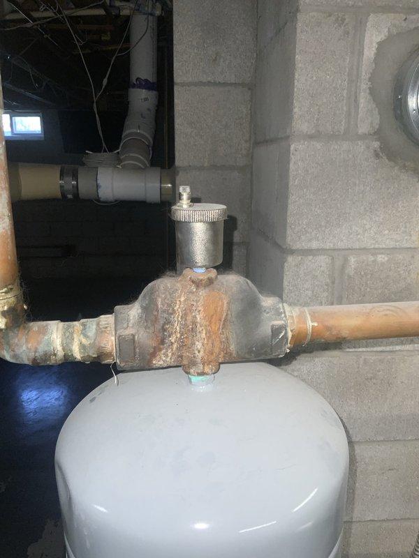 Completed Club Heat10-2 agreement maintenance visit for air handler and system inspection. Visual inspection revealed significant corrosion on expansion tank piping connections and extensive mineral deposit buildup on copper plumbing lines throughout the mechanical system. Documented conditions with photographs for maintenance records and customer reference.