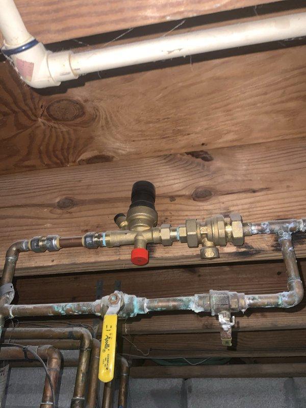 Completed Club Heat10-2 agreement maintenance visit for air handler and system inspection. Visual inspection revealed significant corrosion on expansion tank piping connections and extensive mineral deposit buildup on copper plumbing lines throughout the mechanical system. Documented conditions with photographs for maintenance records and customer reference.