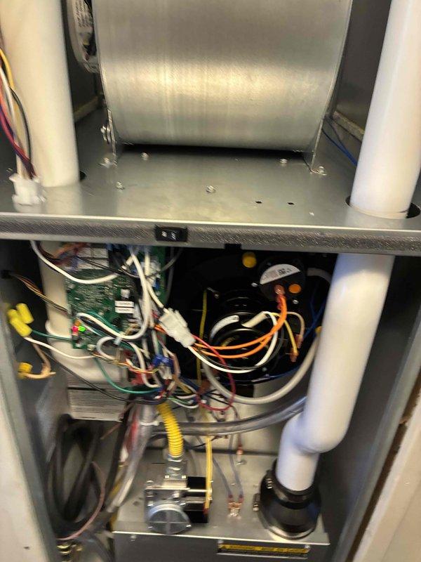 Completed full HVAC system installation in manufactured home including 60,000 BTU gas furnace and 2.5-ton air conditioning unit with rear discharge configuration. Performed all mechanical and electrical connections, installed new dedicated electrical circuit to code, and properly configured condensate drainage system with PVC piping through ceiling penetration. All wiring, control boards, blower assembly, and safety devices tested and verified operational upon system startup.