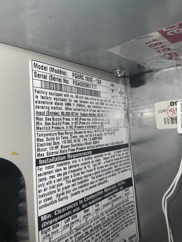 Responded to no-cool call on 21-year-old central air conditioning system. Upon arrival, confirmed compressor operation but no airflow from supply vents. Inspection revealed furnace blower motor failure preventing conditioned air distribution throughout ductwork. Given age of equipment (FG6RC 060C-12A model, serial EGA20901711) and extent of wear, recommended system replacement rather than repair. Documented equipment specifications and existing installation for replacement quote preparation.