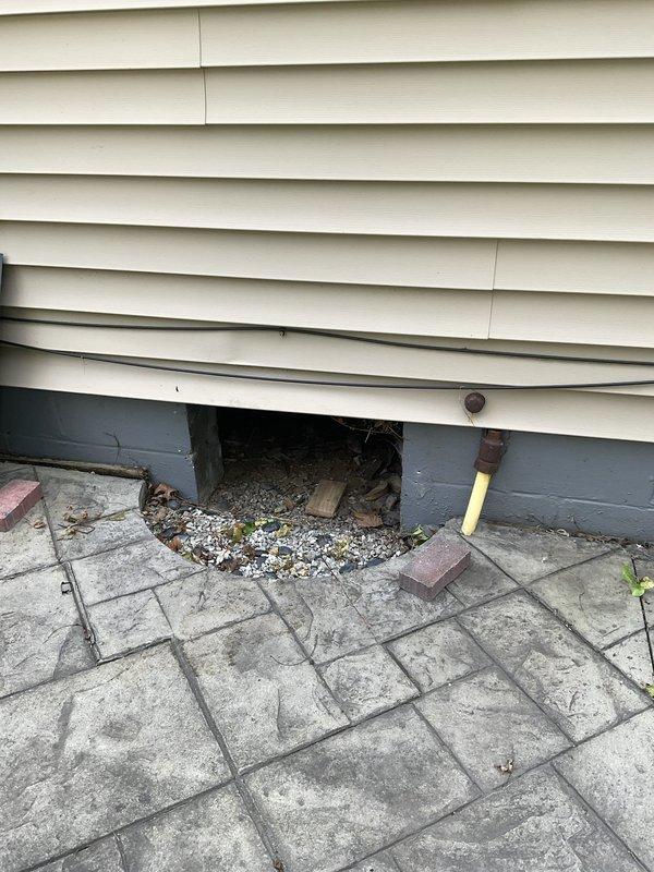 Conducted comprehensive ductwork estimate for crawl space installation measuring 10-12 inches. Assessed crawl space access point beneath foundation with existing structural support and evaluated interior conditions for HVAC distribution system routing. Documented existing mechanical systems including furnace, condensate drainage configuration with PVC piping, and current ductwork connections to determine optimal pathway for new or replacement ductwork installation in the crawl space area.