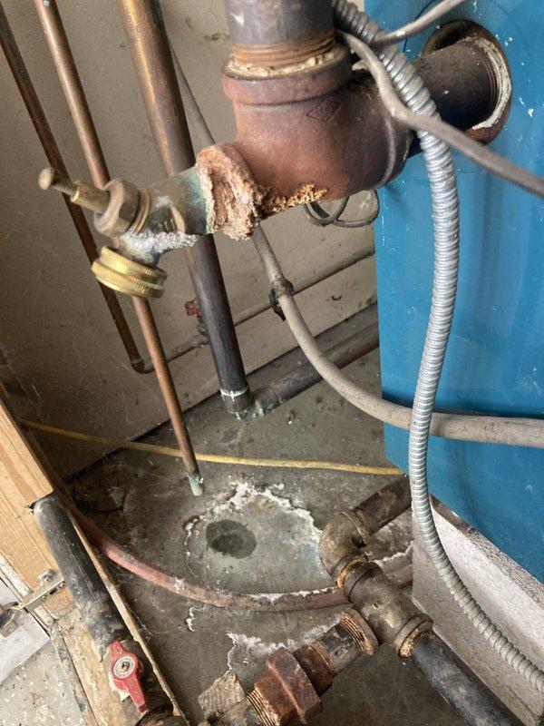 Completed routine heating system maintenance and tune-up on a low-pressure boiler system (Model 204PCL GE12, 96,000 BTU/HR input) located in basement. Performed comprehensive inspection of all system components, including burner assembly, gas controls, venting system with automatic vent damper, and associated piping. Noted significant corrosion and mineral buildup on pipe joints and valve assembly near boiler connections, indicating age-related deterioration that should be monitored for potential future replacement. All copper supply lines and flexible conduit connections inspected and found functional. System operational with no immediate safety concerns reported at time of service.