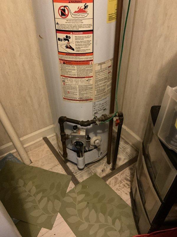 Provided estimate for replacement of non-functional Kenmore PowerMister standard water heater in residential utility closet. Existing unit is a natural draft model requiring standard replacement installation. Assessed current plumbing connections, gas supply lines, and venting configuration to determine scope of work for new water heater installation.