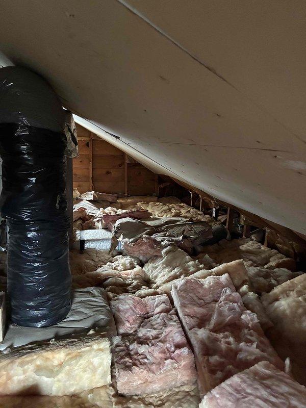 Provided comprehensive estimate for horizontal attic furnace replacement and new air conditioning system installation in 600 square foot residential property with forced air heating. Assessed existing 24-year-old furnace unit located in attic space, evaluated current ductwork configuration with pink fiberglass insulation between joists, and determined scope of necessary modifications including additional duct work and electrical upgrades required for complete HVAC system installation.