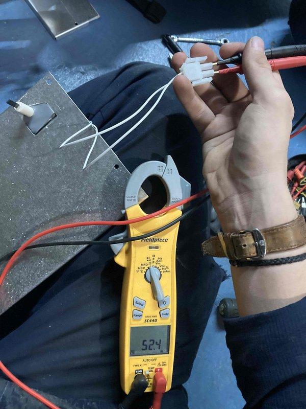 Completed preventive maintenance agreement visit for air handler and system inspection. Installed Intermatic AG3000 Series surge protective device (120-240V, Type 1/Type 2 rated) in attic location to protect HVAC equipment from electrical surges. Verified proper electrical connections using Fieldpiece SC440 clamp meter, confirming system amperage reading of 52.4 amps within normal operating parameters.
