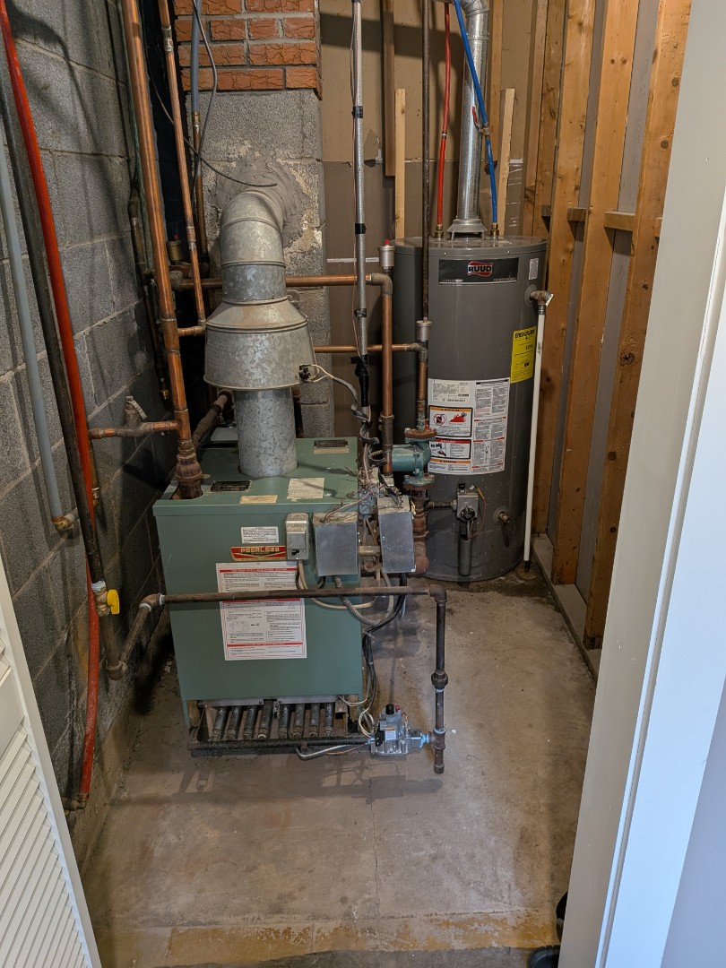 Routine maintenance on gas fired hot water boiler and gas fired hot water heater.