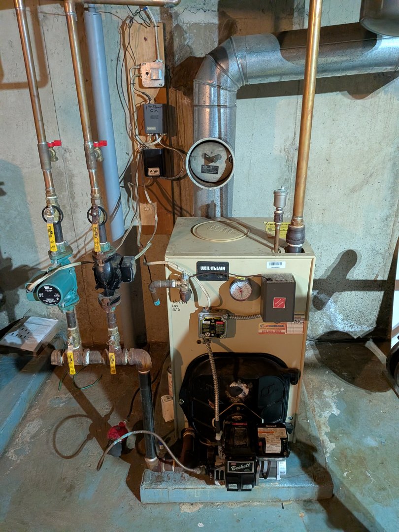 Heating service- Routine maintenance on oil fired weil-mclain gold hot water boiler and ductless heat pump cleaning.