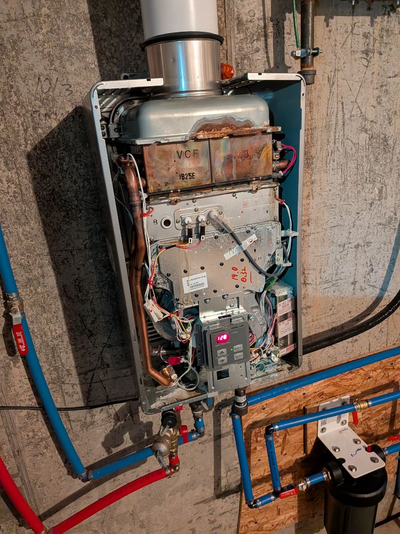 Heating service- Routine maintenance on Rinnai tankless water heater and Amana furnace.