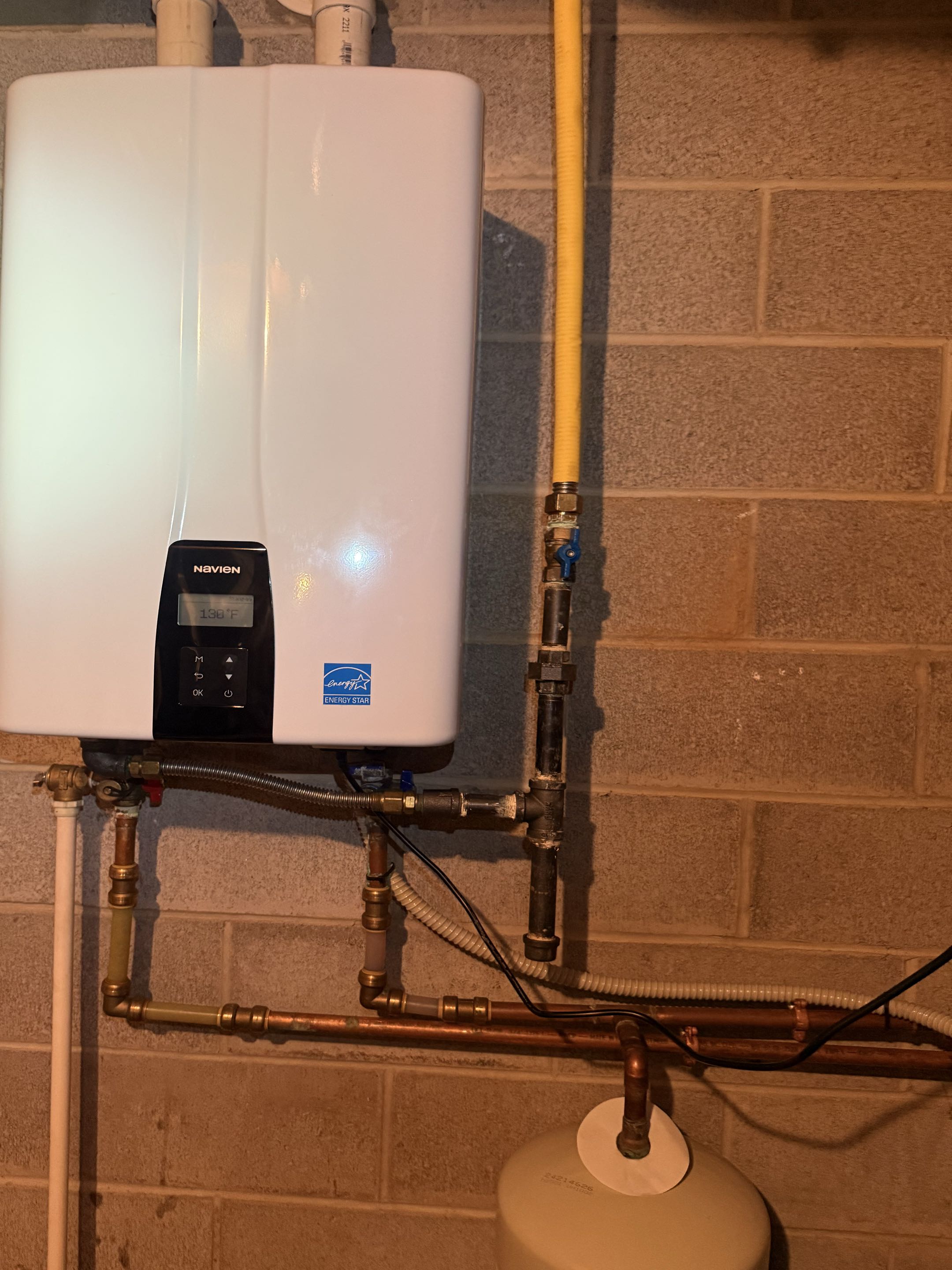 Routine maintenance on AirTemp AC system, ComfortMaker furnace, and Navien tankless water heater