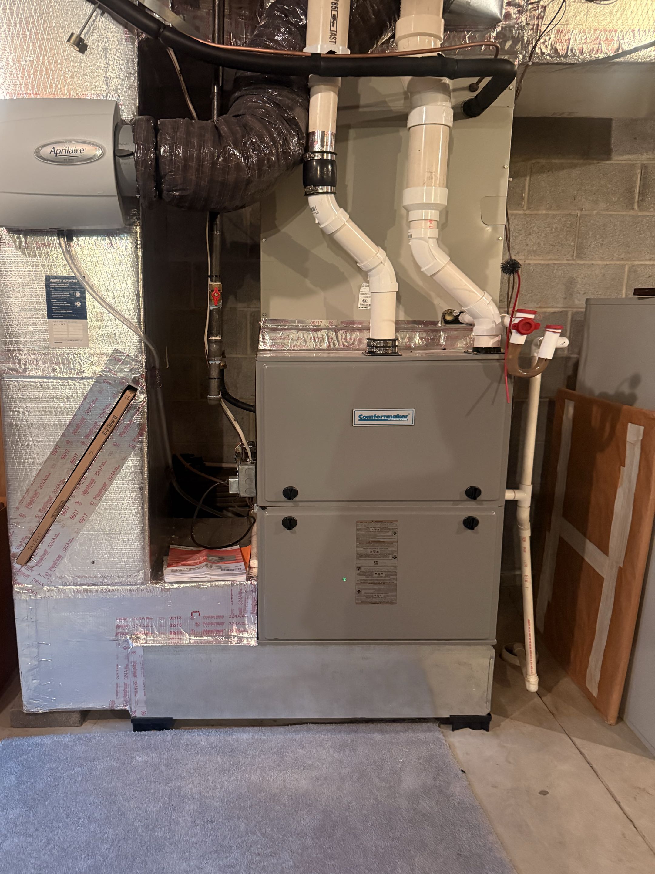 Routine maintenance on AirTemp AC system, ComfortMaker furnace, and Navien tankless water heater