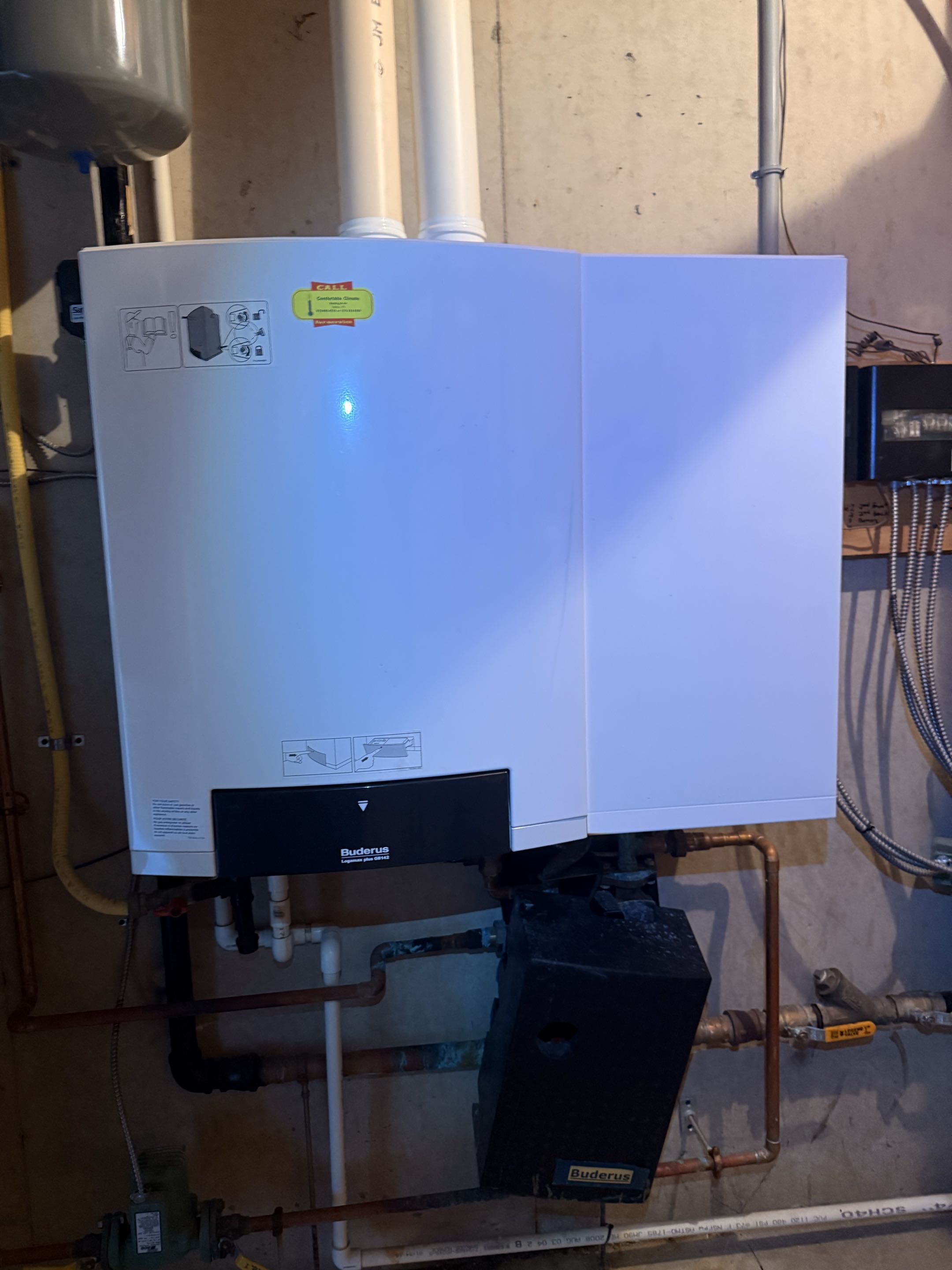 Routine maintenance on Buderus gas fired condensing boiler & Amana A/C Systems 