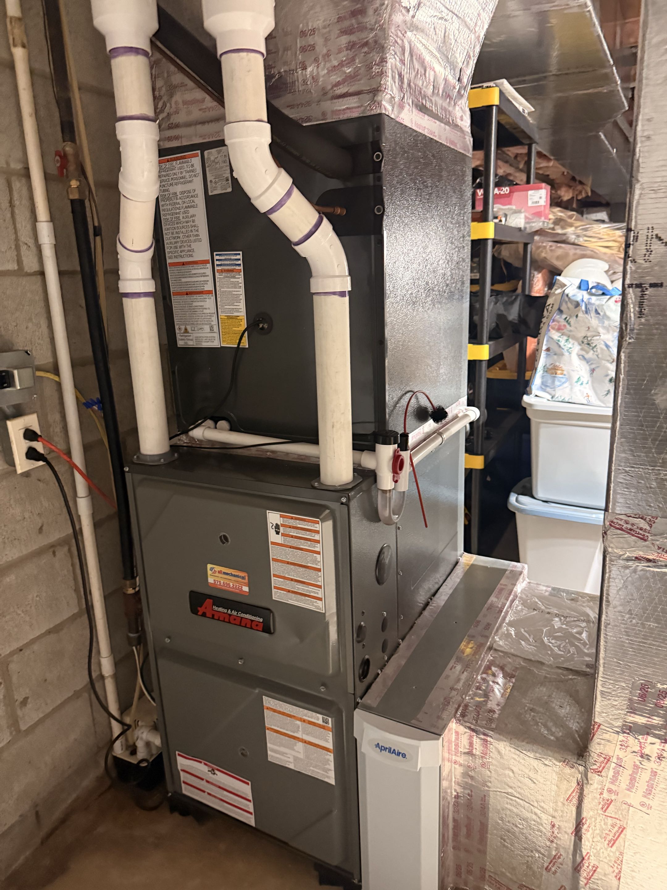Routine maintenance on two Amana gas fired furnaces 