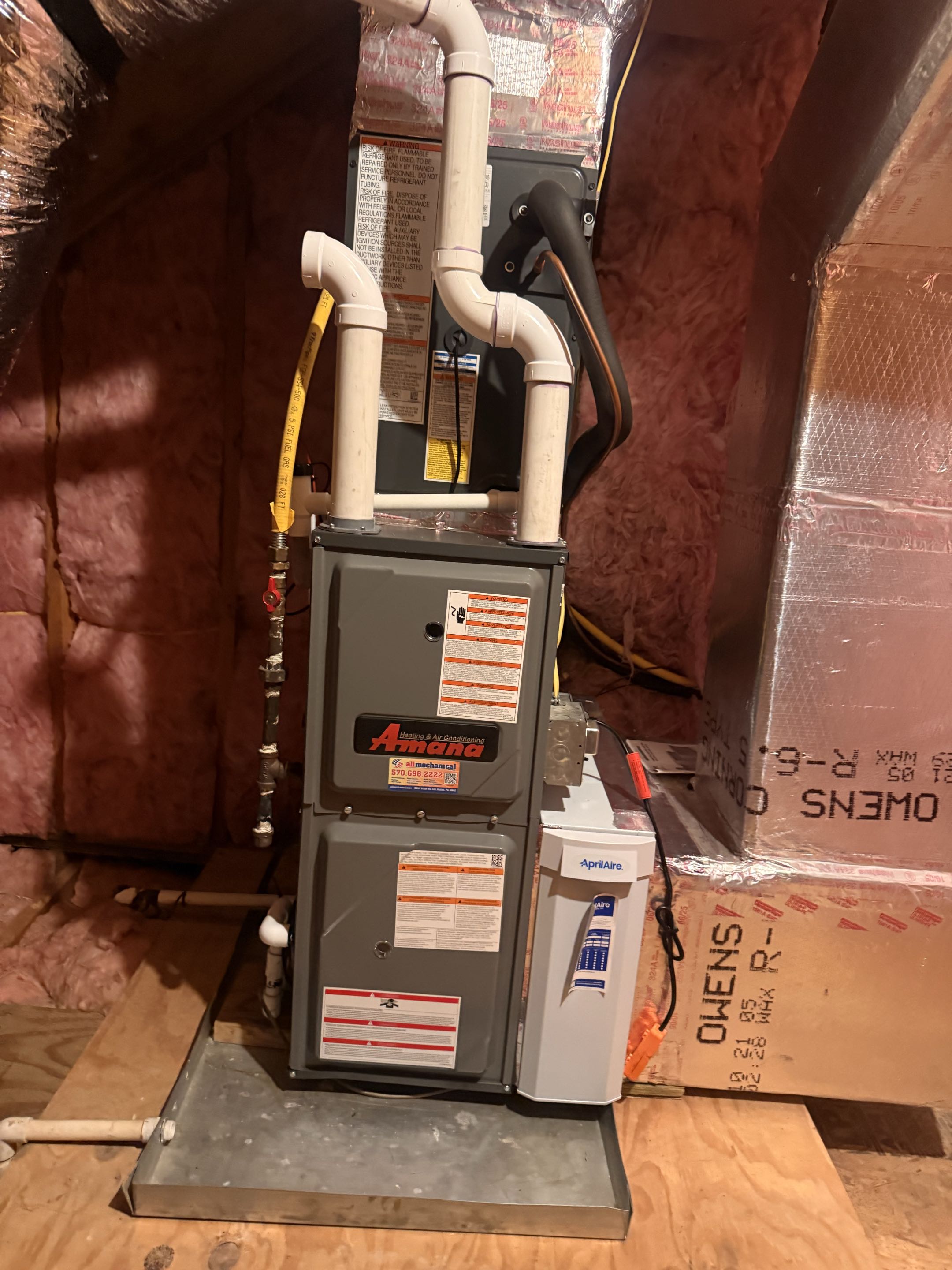 Routine maintenance on two Amana gas fired furnaces 