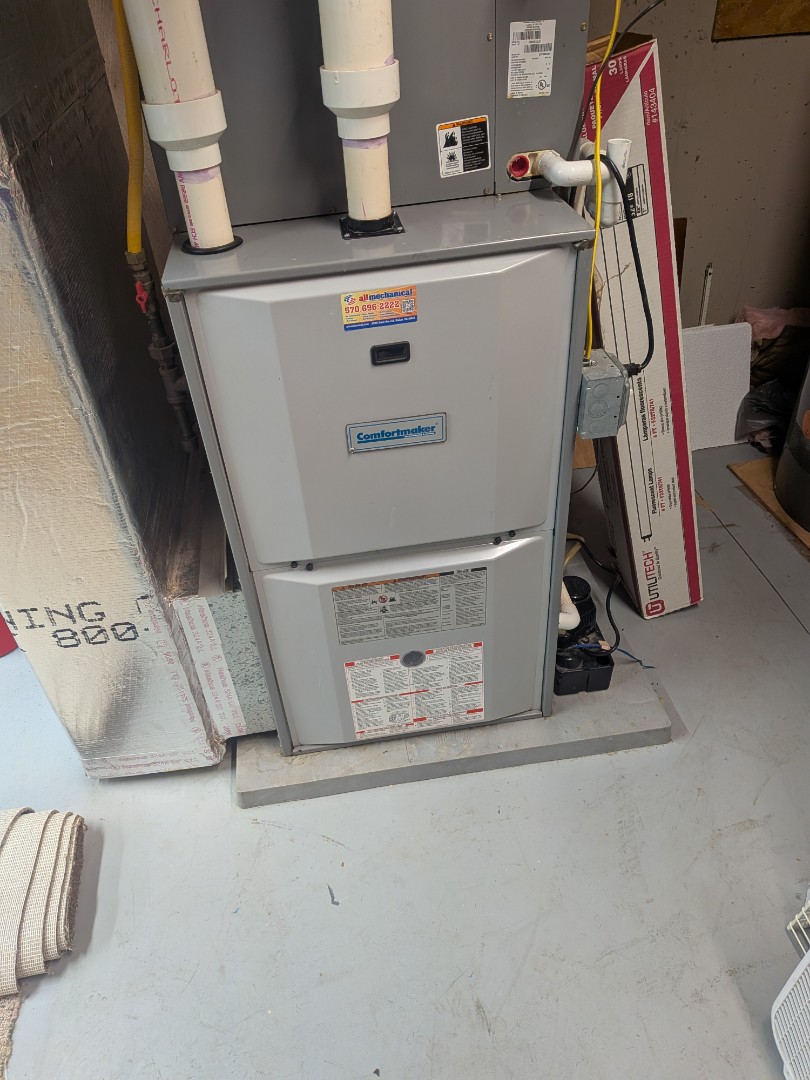 Routine maintenance on Comfortmaker furnace.
