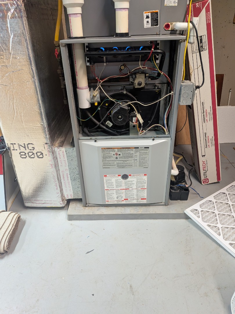 Routine maintenance on Comfortmaker furnace.