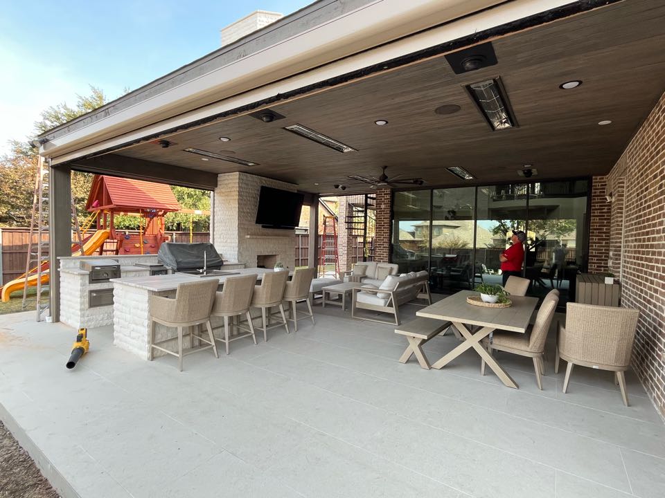 Putting the finishing touches on a beautiful patio cover with outdoor kitchen in Castle Hills.