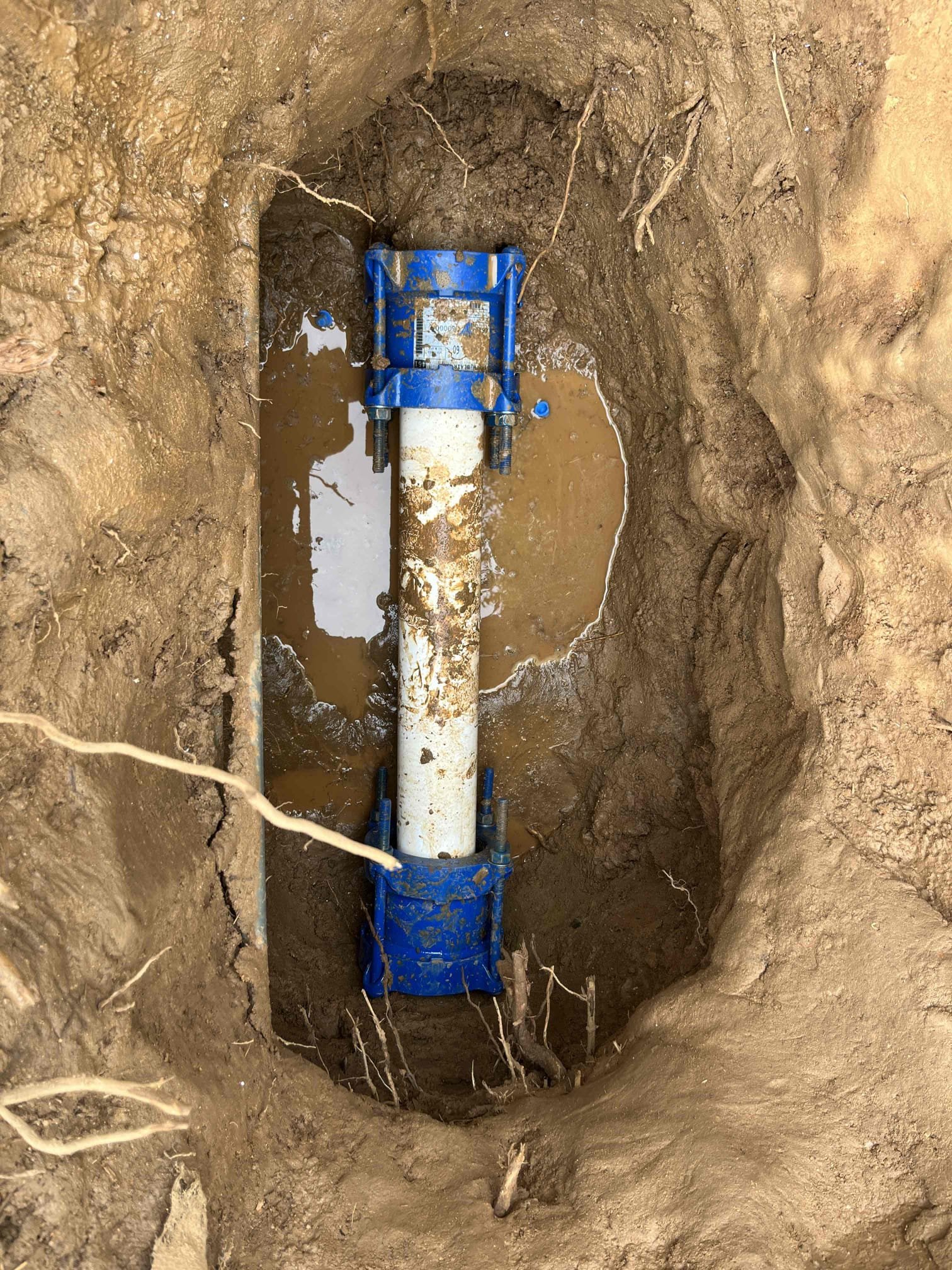 Customers 4” concrete water main was broken and causing flooding. Removed damaged section and plumbed in with new 4” pvc and used smith Blair 4.46-5.60” quantum couplings to join the two different materials together 
