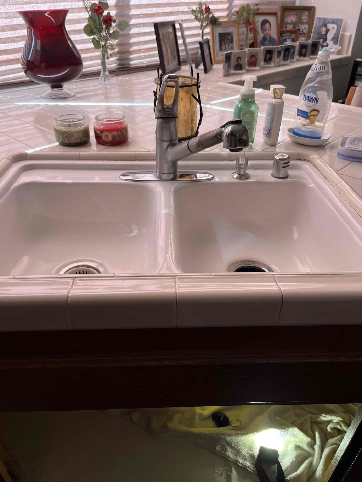 Customers existing kitchen faucet was leaking down in cabinets below. Removed old faucet and installed new Moen kitchen faucet 