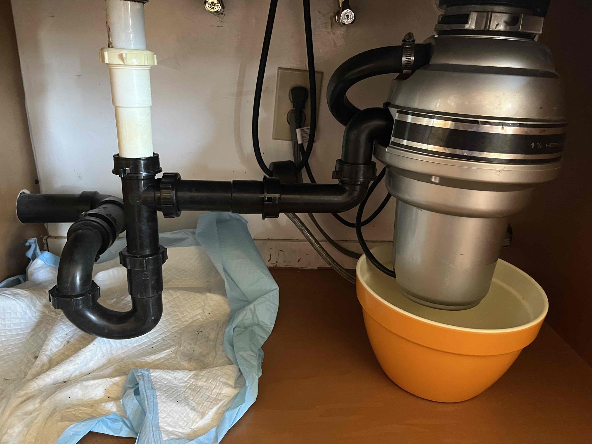 Cleared kitchen sink clog via cleanout access. Customer had large amounts of sludge leading to clog. While inspecting drain I doing the elbow coming out of disposal was fractured. Replaced elbow 