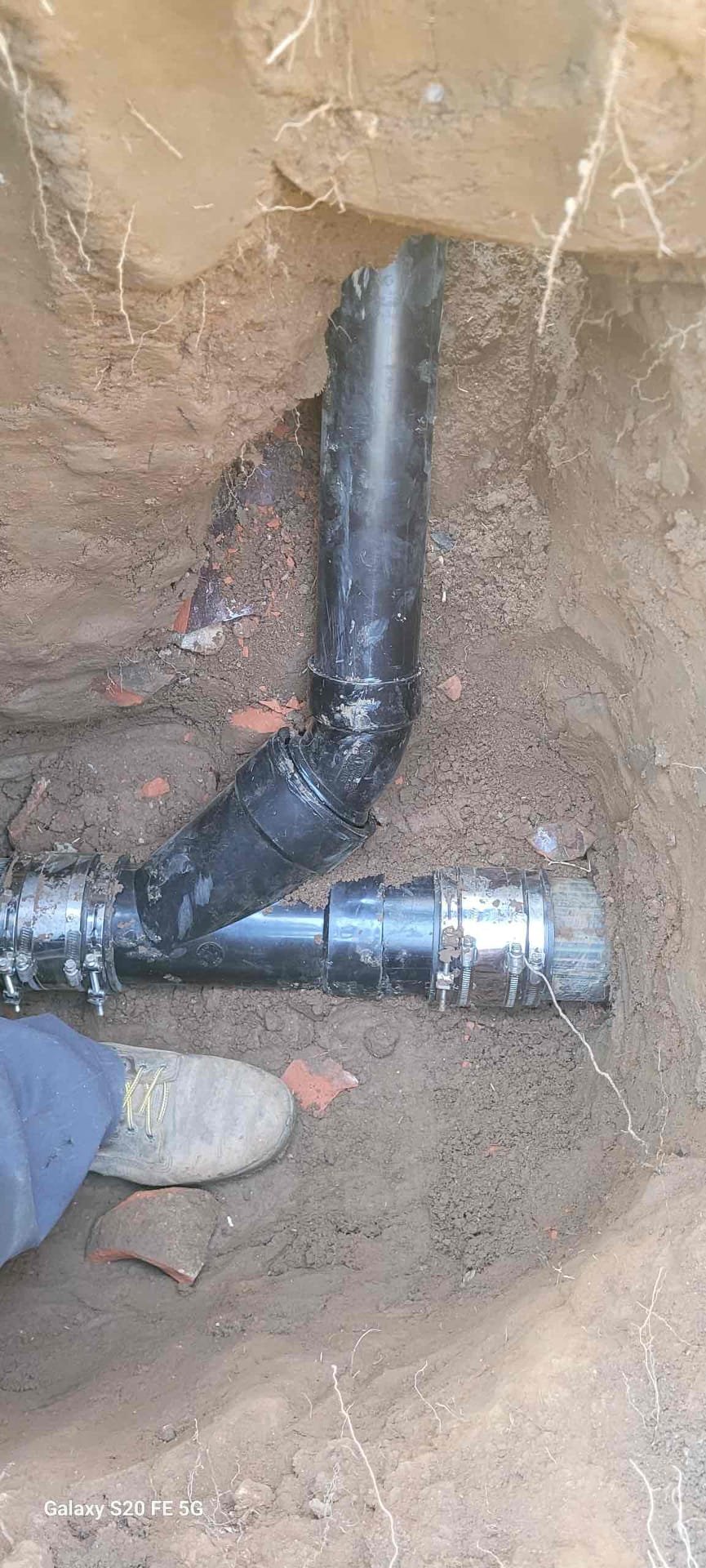 Customer has a 3’ section of old clay pipe that has roots and several offsets causing the laundry line to continually back up after several cycles are ran. Recommend digging this section up and performing repair 
Dug and replaced approximately 6’ of damaged laundry drain.  Customer has a 3’ section of old clay pipe that has roots and several offsets causing the laundry line to continually back up after several cycles are ran. Recommend digging this section up and performing repair 
Dug and replaced approximately 6’ of damaged laundry drain.