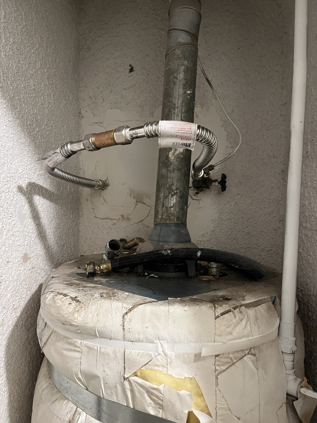 Upon arrival I found customers water heater to be leaking in hallway closet. Shut water off and noticed gate valve was not closing properly. Temporarily bipassed water feed for heater. Drained water heater and attempted to extract as much water as possible.  Upon arrival I found customers water heater to be leaking in hallway closet. Shut water off and noticed gate valve was not closing properly. Temporarily bipassed water feed for heater. Drained water heater and attempted to extract as much water as possible.