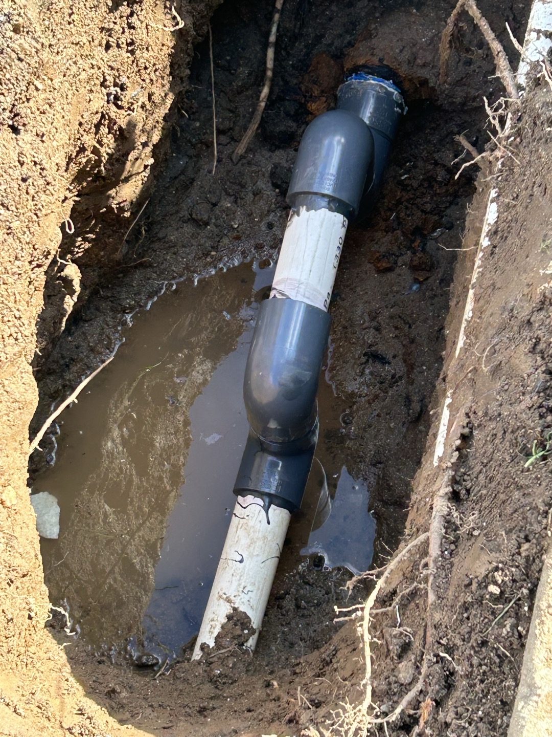 Customer has 1.5” water main where pvc connects to existing galvanized. Will need to dig up and further expose piping in order to repair.  