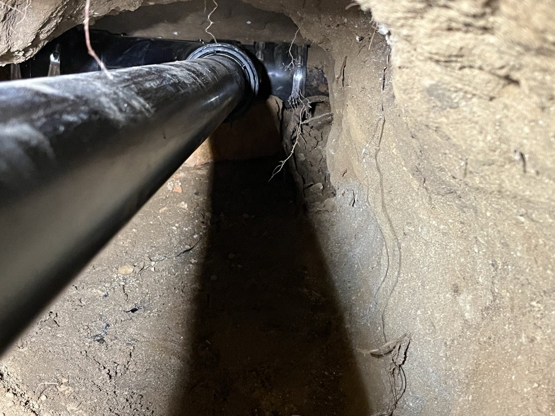 Customers existing sewer main has failed and is completely miss in the bottom of the pipe. Attempted to perform camera inspection but was unable to do so due to the condition of drain. Recommend digging a large hole in the walk in cooler that will allow us to tunnel under the footing and further expose the drain to inspect which direction the drain travels, as well to attempt to find a good location to connect to. Once location of travel is determined as well as condition we can provide a more accurate estimate for replacement if need be. 

Was able to tunnel approximately 5’past the footing and found a 4” comby that was leading out towards the front of the building. Removed comby and plumbed in new comby connecting the floor sinks into the sewer main. Although we were able to find a section of pipe that had the bottom in tact i strongly suggest replacement of the sewer main. The existing 4” cast iron we connected to was very brittle. We also performed camera inspection and saw large a