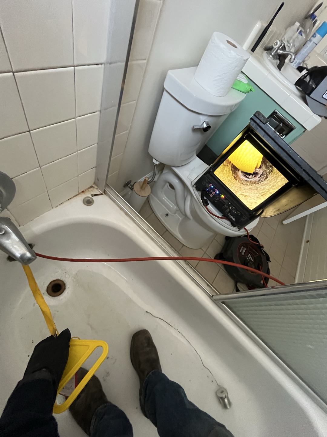 Drain stopper for bathtub corroded off puppy system and became lodged in waste and overflow assembly. Attempted several different tactics in attempt to remove obstruction including wrapping a rope around stopper and pulling it up, but the stopper was lodged inside drain and not moving. Only other option is to access waste and overlfow from behind bathtub and replacement waste and overflow. 