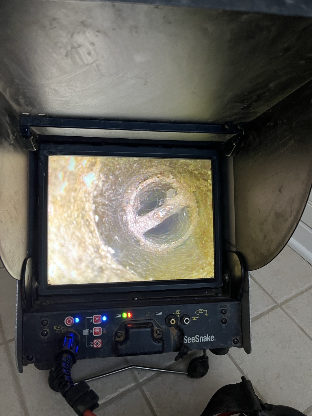 Drain stopper for bathtub corroded off puppy system and became lodged in waste and overflow assembly. Attempted several different tactics in attempt to remove obstruction including wrapping a rope around stopper and pulling it up, but the stopper was lodged inside drain and not moving. Only other option is to access waste and overlfow from behind bathtub and replacement waste and overflow. 